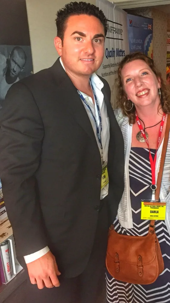 TruLife team member with a UNFI team member at a historical industry event