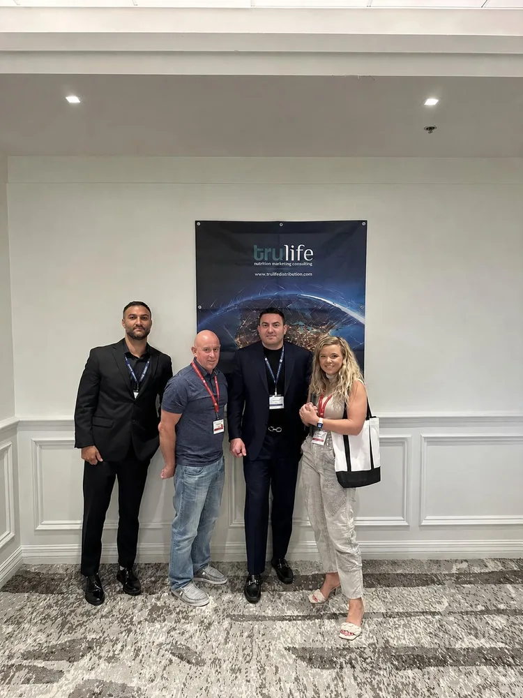 TruLife team member with members of the Vitamin Shoppe team at a historical meeting