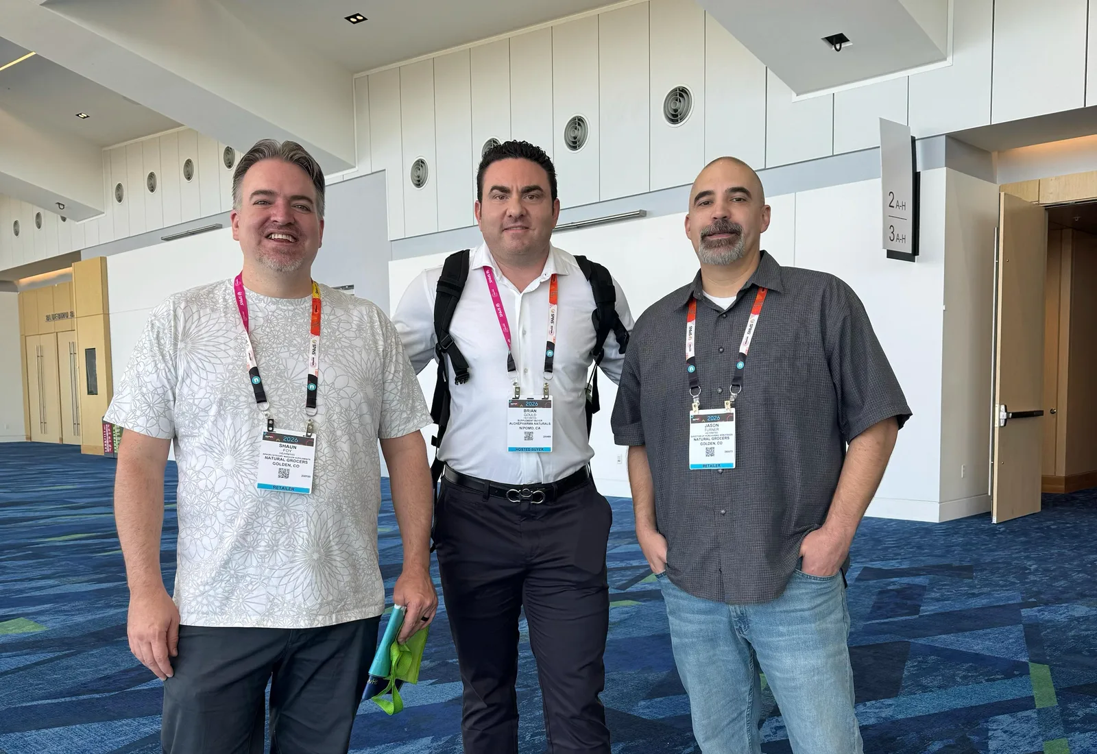 TruLife team member with members of the Natural Grocers purchasing team at Newtopia Now